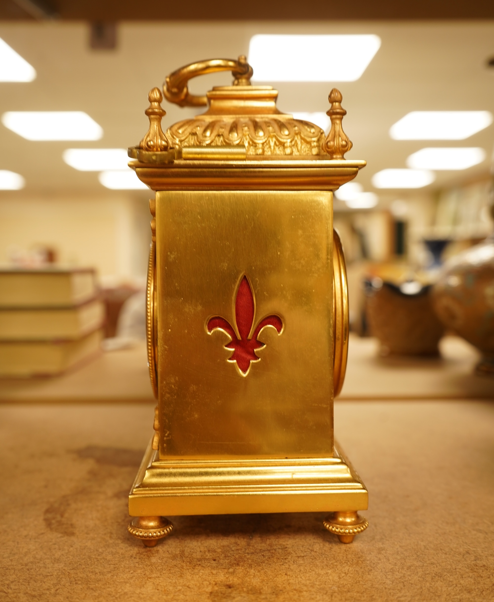 A French gilt brass timepiece with key, 19cm high